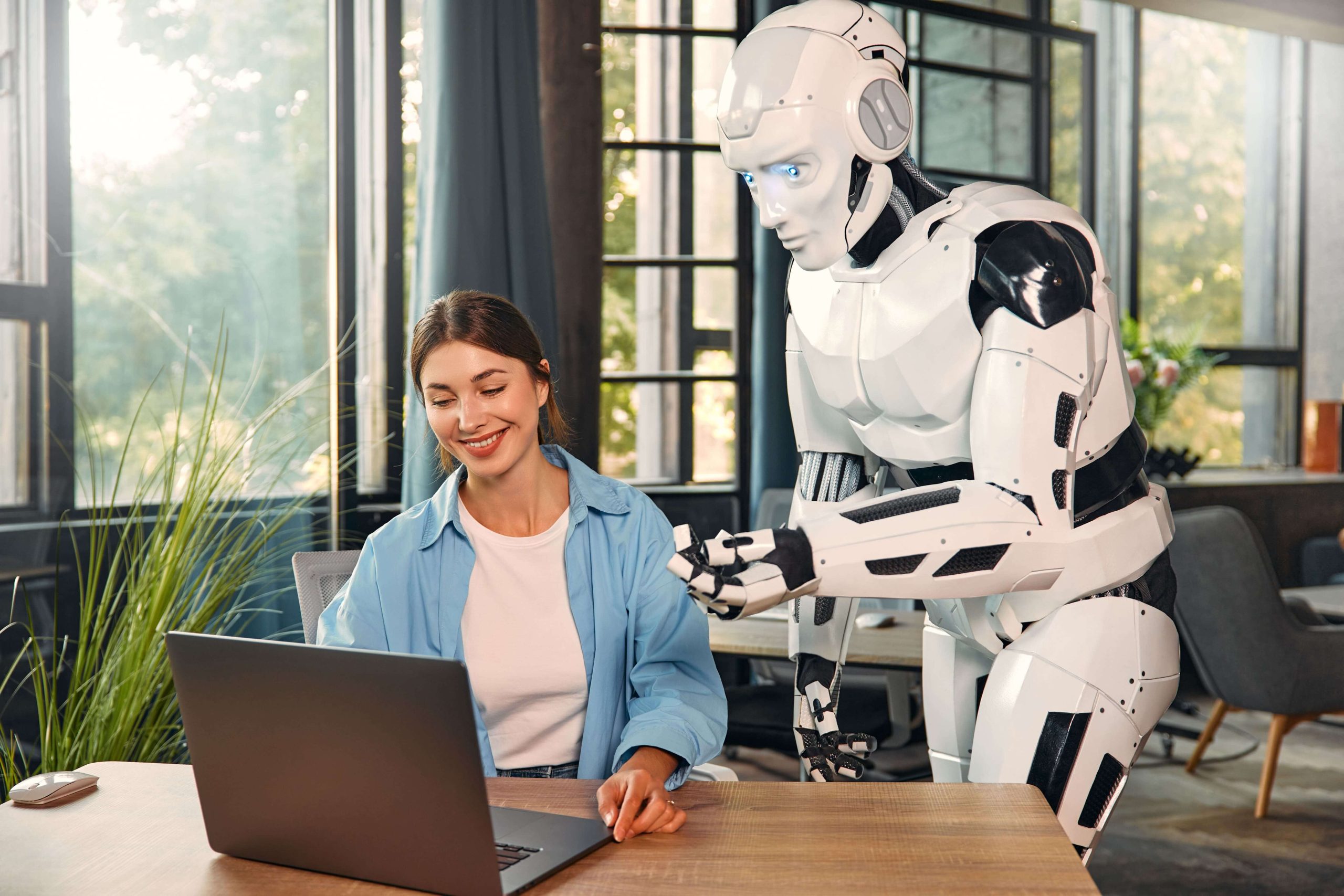 robot-and-woman-working-on-laptop-in-office-2025-03-31-17-44-41-utc (1) (1)